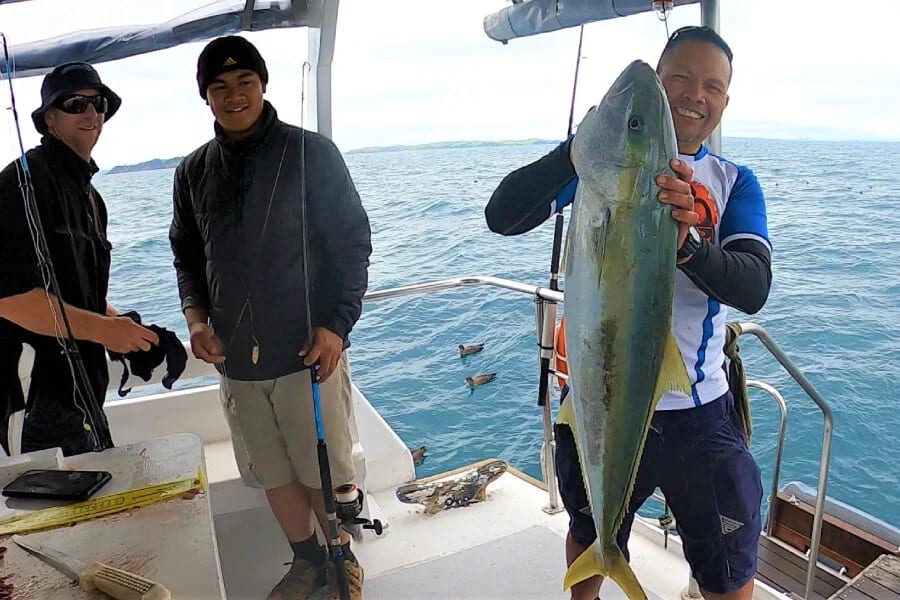 Guests fishing from MV Koru